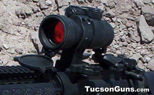 Red dot sight mounted on a rifle