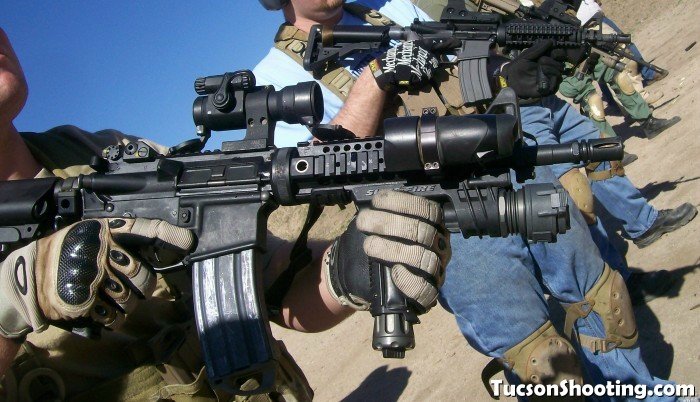 Shooter running an optic-equipped carbine